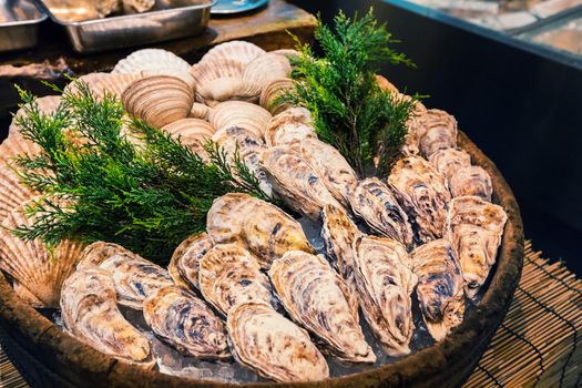 Fresh oyster on ice as street food at Nishiki market in Kyoto, Japan