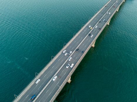 Cars and other vehicles travelling across the Captain Cook Bridge. The bridge crosses near the river mouth as it empties into Botany Bay; and links the St George and Sutherland areas of Sydney.