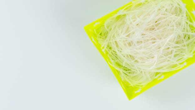 top view vermicelli in basket on white background with copy space