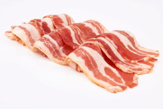 Slices of bacon on white background