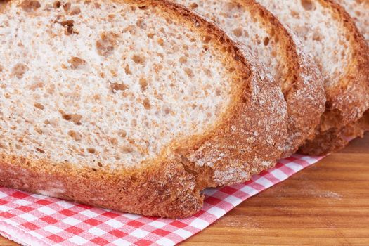 Closeup of sliced bread on a chopping board