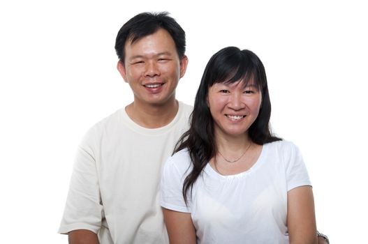 Asian mature couple sitting with smiling face, on white background. 