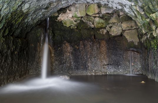 Ancient Roman Water mill inside stream 