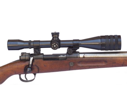 Black scope close-up on old sniper rifle isolated on white