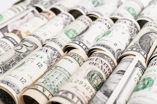 dollar rolls in a row close-up 