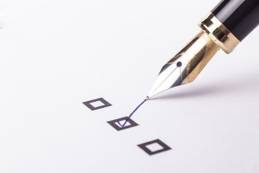 Checklist with the second option checked and a foutain pen on white page