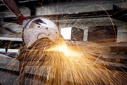 Metal cutting close-up with electrical grinder with sparks