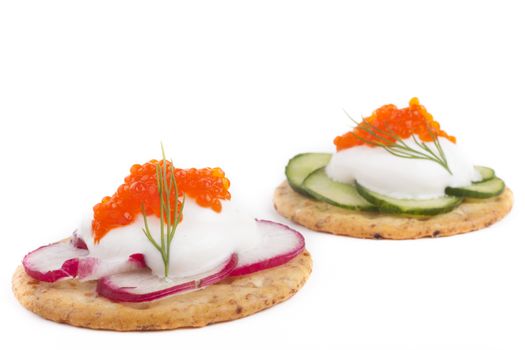 Red caviar on white cheese  appetizer on white background