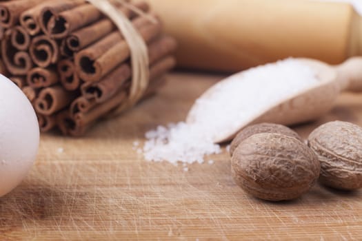 Baking ingredients close-up on brown wod board