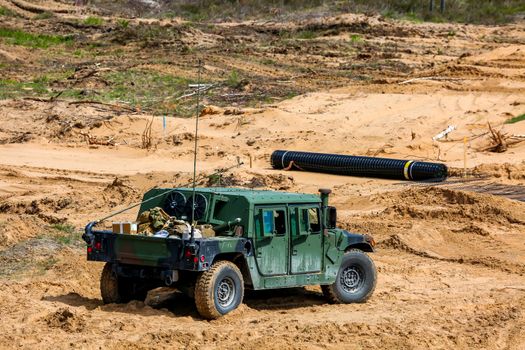 NATO Hummer military vehicles. Soldier on armored Hummer. International Military Training "Saber Strike 2017", Adazi, Latvia, from 3 to 15 June 2017. US Army Europe-led annual International military exercise Saber Strike Field Training Exercise in Latvia.
