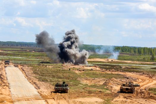 Explosion, smoke and military vehicles. International Military Training "Saber Strike 2017", Adazi, Latvia, from 3 to 15 June 2017. US Army Europe-led annual International military exercise Saber Strike Field Training Exercise in Latvia.