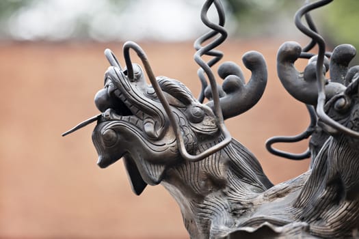 Metal dragon sculpture in a temple in Hanoi, Vietnam