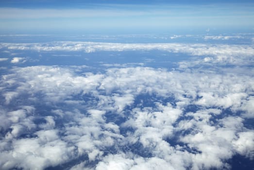 Wing of an airplane and the land below