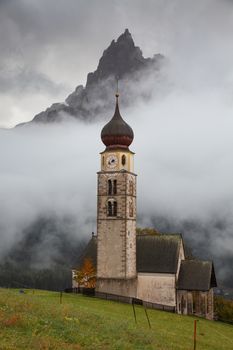 san Valentino church on a foggy late autumn day, Siusi allo Sciliar, Castelrotto, Dolomites, Italy