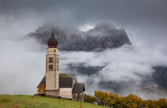 san Valentino church on a foggy late autumn day, Siusi allo Sciliar, Castelrotto, Dolomites, Italy