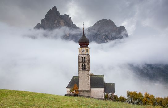 san Valentino church on a foggy late autumn day, Siusi allo Sciliar, Castelrotto, Dolomites, Italy