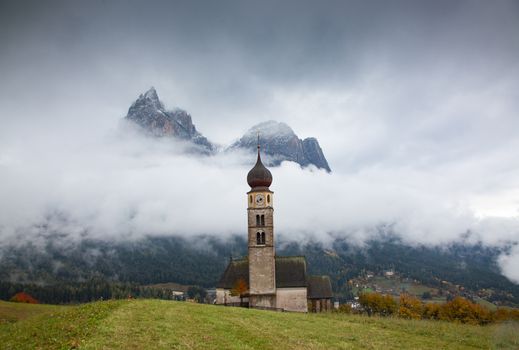 san Valentino church on a foggy late autumn day, Siusi allo Sciliar, Castelrotto, Dolomites, Italy