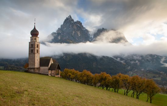 san Valentino church on a foggy late autumn day, Siusi allo Sciliar, Castelrotto, Dolomites, Italy