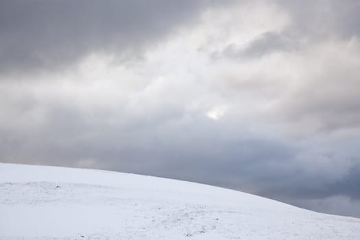 snowy hill and blue sky