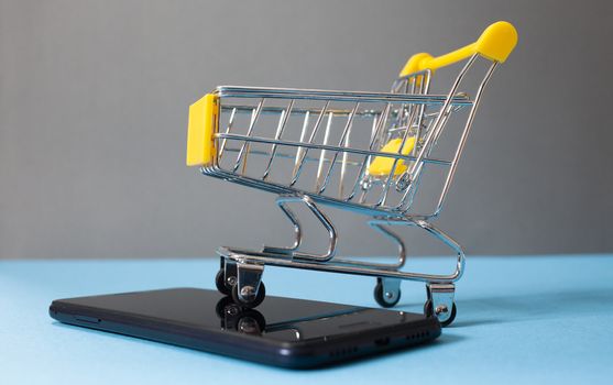  shopping cart on smartphone - e-commerce