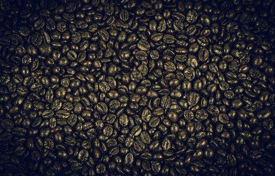 Brown background texture, detail of roasted coffee beans, flavor and caffeine