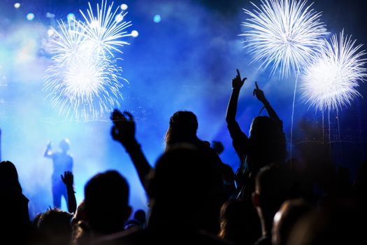 crowd watching fireworks - New Year celebrations- abstract holiday background