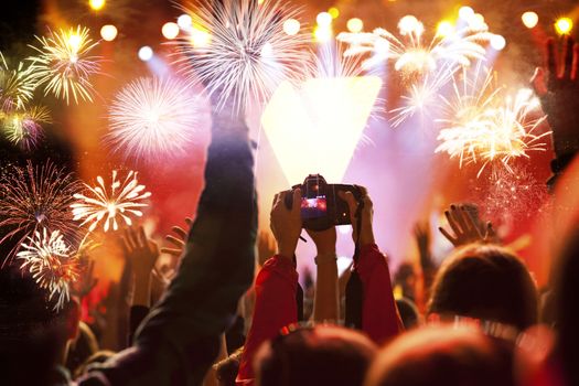 crowd watching fireworks - New Year celebrations- abstract holiday background