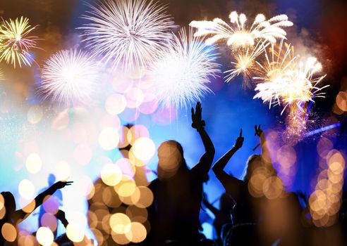 crowd watching fireworks - New Year celebrations- abstract holiday background