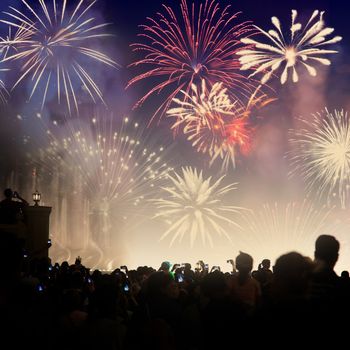 crowd watching fireworks - New Year celebrations- abstract holiday background