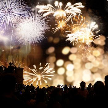 crowd watching fireworks - New Year celebrations- abstract holiday background