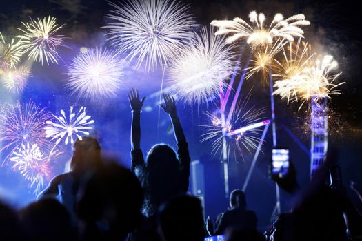 crowd watching fireworks - New Year celebrations- abstract holiday background