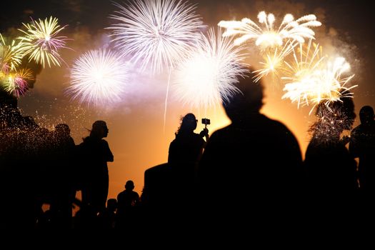 crowd watching fireworks - New Year celebrations- abstract holiday background