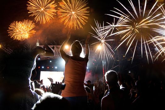 crowd watching fireworks - New Year celebrations- abstract holiday background