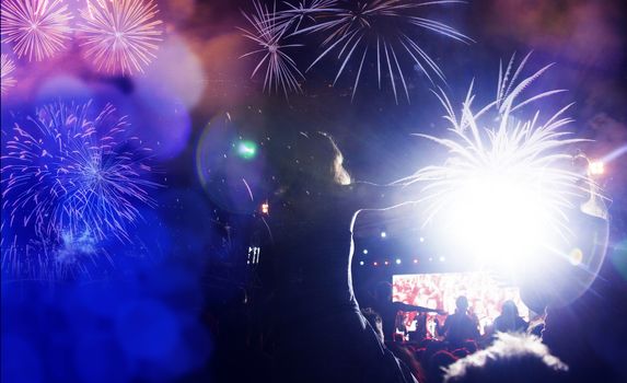 crowd watching fireworks - New Year celebrations- abstract holiday background