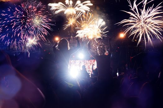 crowd watching fireworks - New Year celebrations- abstract holiday background