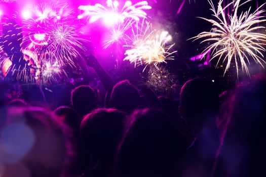 crowd watching fireworks - New Year celebrations- abstract holiday background