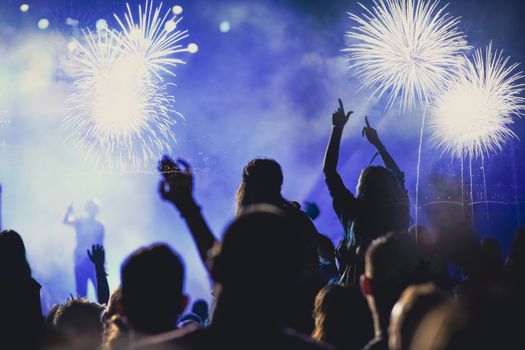 crowd watching fireworks - New Year celebrations- abstract holiday background