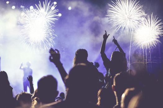 crowd watching fireworks - New Year celebrations- abstract holiday background