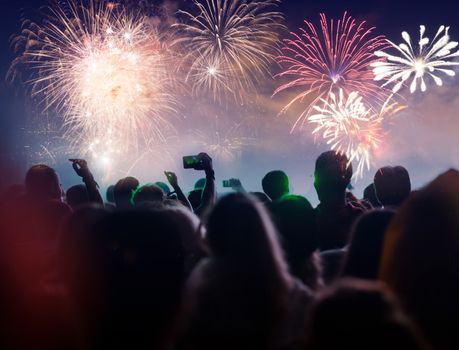 cheering crowd with raised hands at concert - music festival