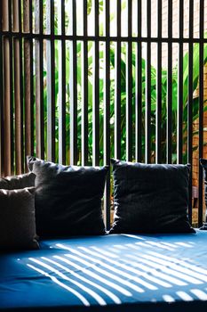 Detail of Modern living room interior with cozy sofa and pillows.