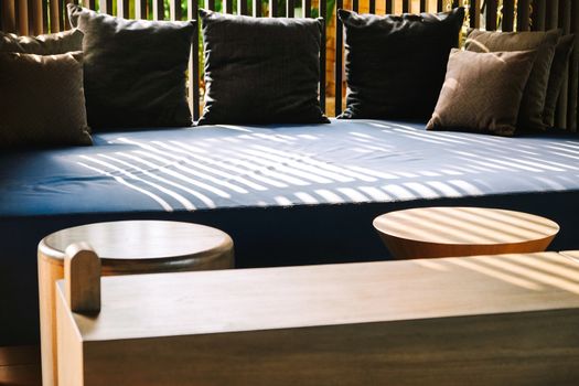 Detail of Modern living room interior with cozy sofa and pillows.