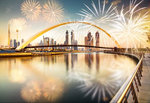 fireworks around Tolerance bridge - exotic New Year destination, Dubai, UAE