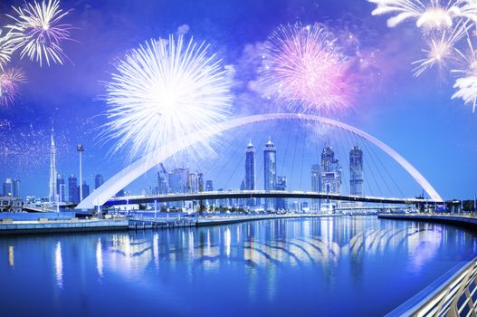 fireworks around Tolerance bridge - exotic New Year destination, Dubai, UAE