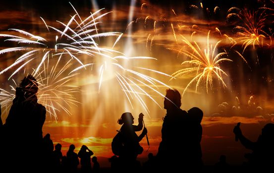 crowd of people watching fireworks