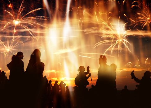 crowd of people watching fireworks