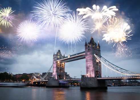 celebratory fireworks over Tower Bridge - New Year destination.  London.  UK