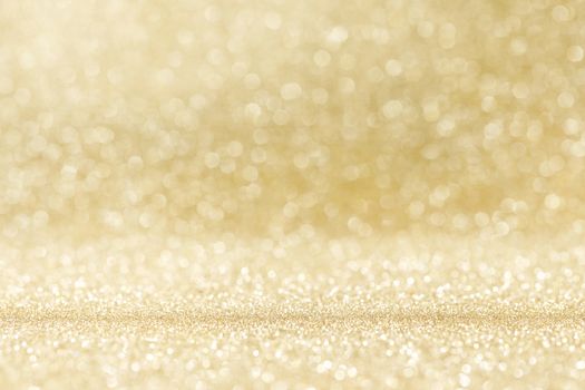 Abstract shining glitters gold holiday bokeh background with copy space for text