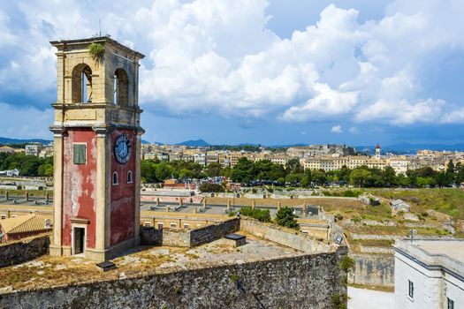 Abandoned clock tower in old fortress in Corfu with panoramic view of Corfu town at Greece.