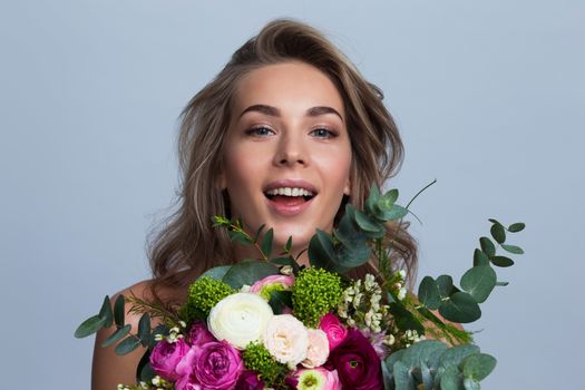 Beautiful woman with bouquet of flowers gift for valentines day