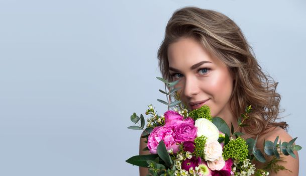 Beautiful woman with bouquet of flowers gift for valentines day